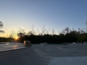 Sun rising over skatepark.